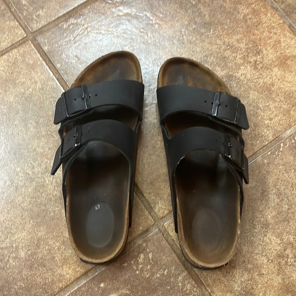 Birkenstock sandals wear and tear but over all good condition.